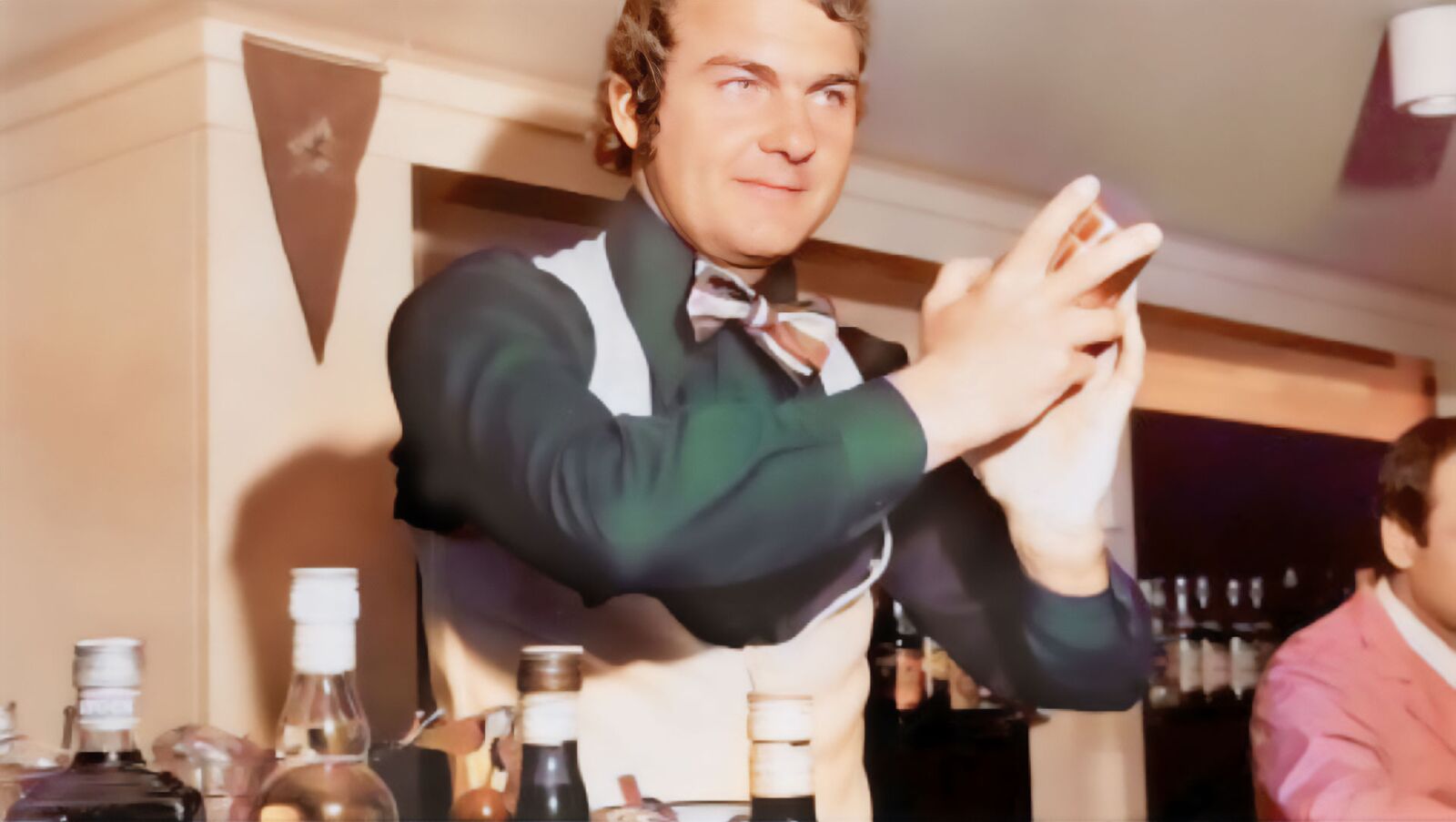 Wolfgang Bartos shaking a cocktail as a flair bartender, the start of the bartending family behind Springbay