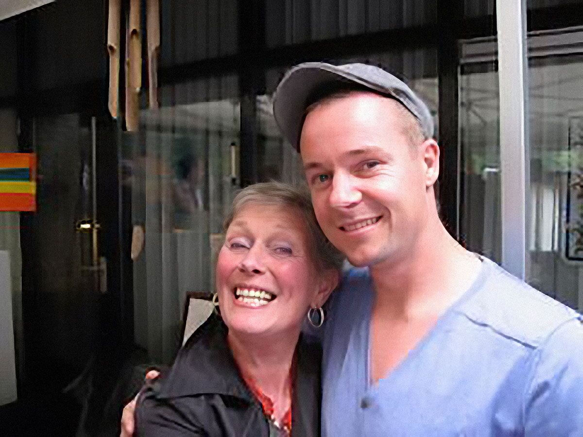 Maria Bartos hugging her son Ian Bartos outside the bar