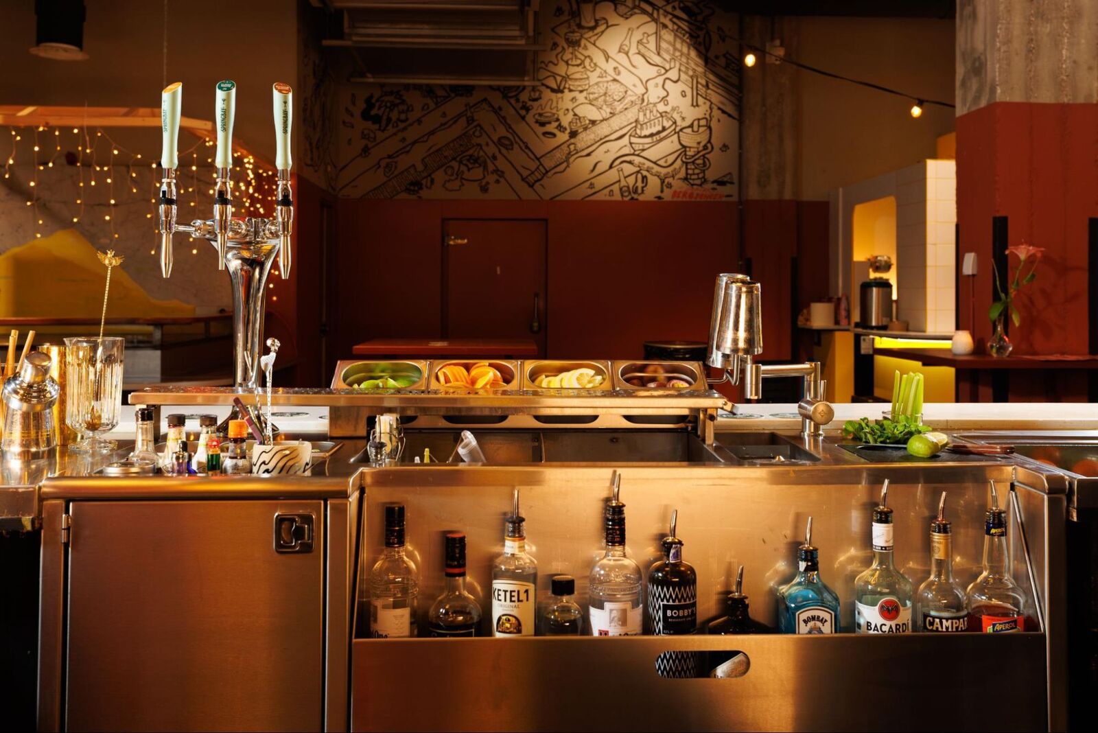 Bar at Foodhallen with a Springbay cocktail tap station, bottles and fresh garnishes