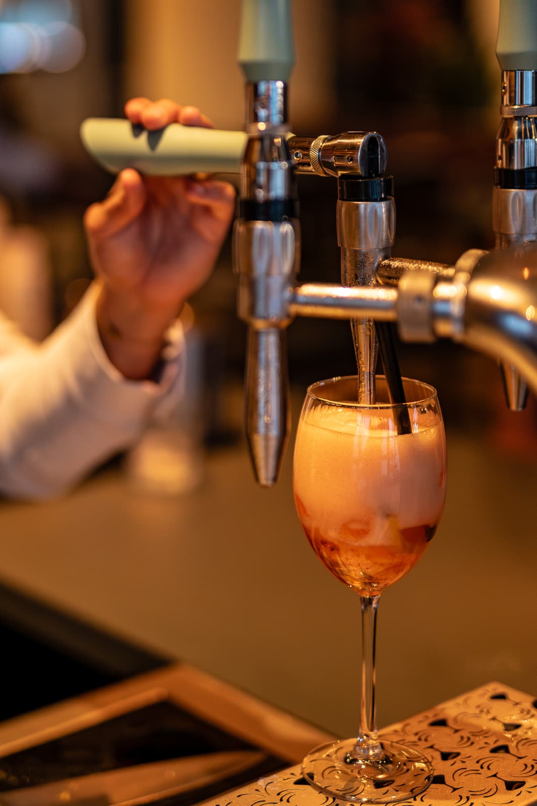 Guest pours a cocktail straight from the Springbay tap at Restaurant Summum