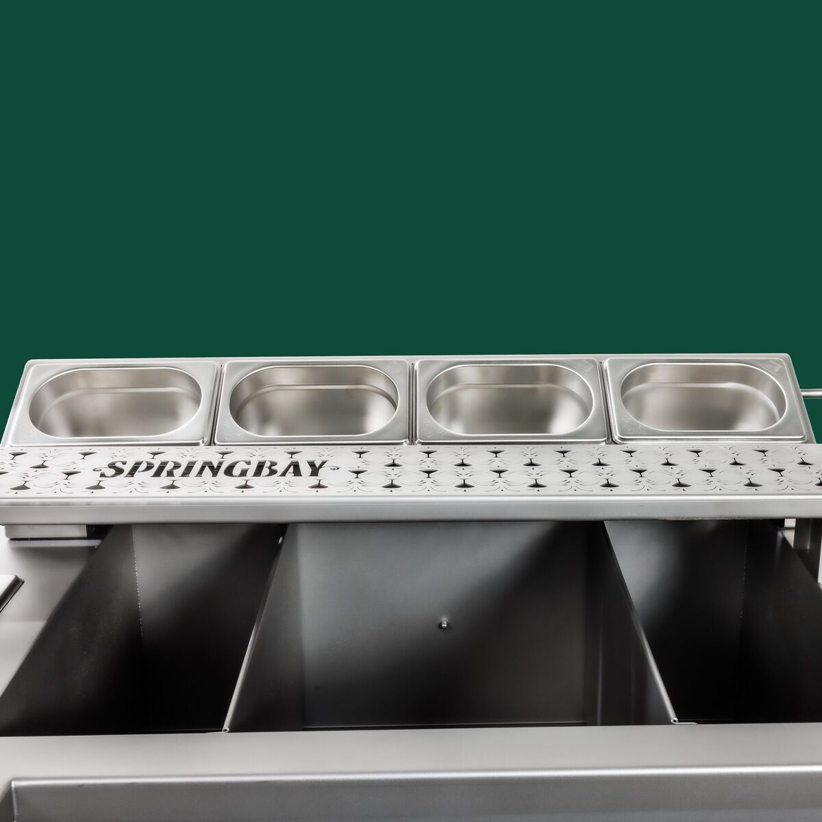 Engraved garnish rail with four trays and the Springbay logo