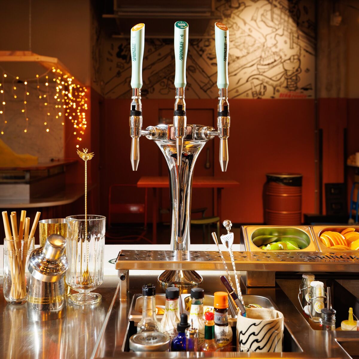 Springbay 3-tap tower in an atmospheric bar with glassware and bottles